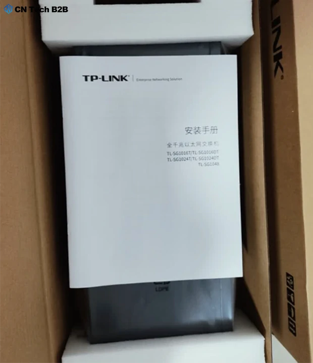 TP-Link TL-SG1024T 24-port Gigabit switch with original packaging, foam protection, and user manual